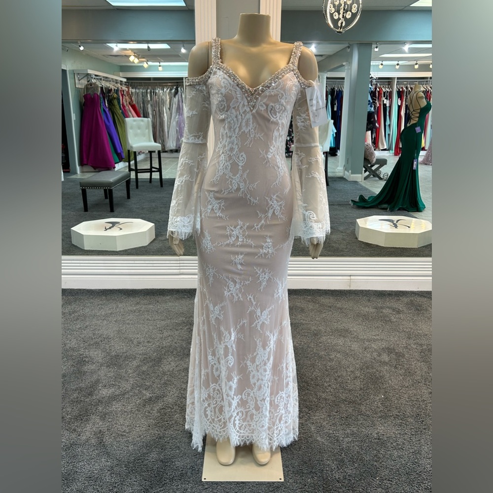 Size 6 and 10 available. SOLD SEPERATELY. lace long sleeve gown